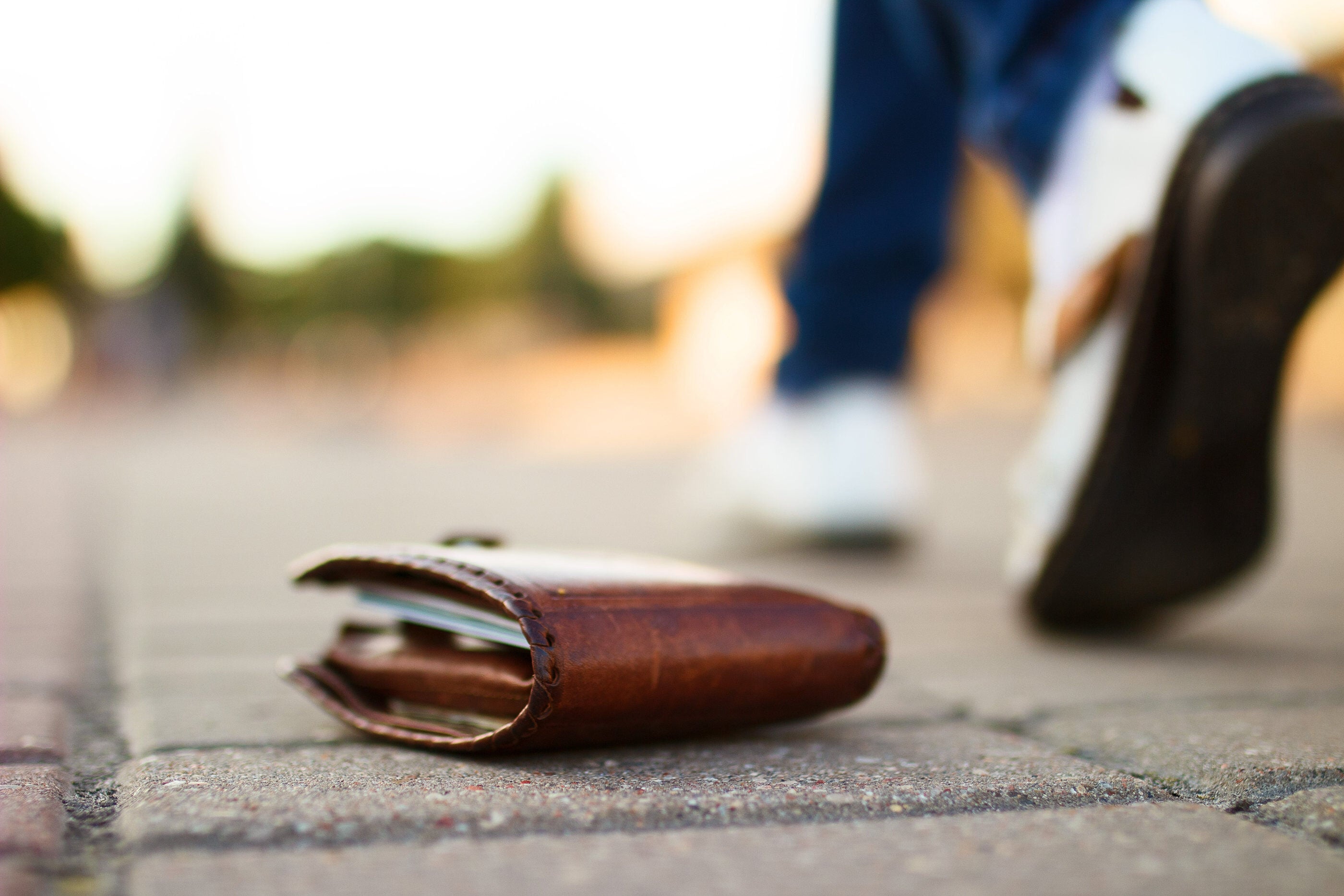 Lost wallet, laying on cobblestone street