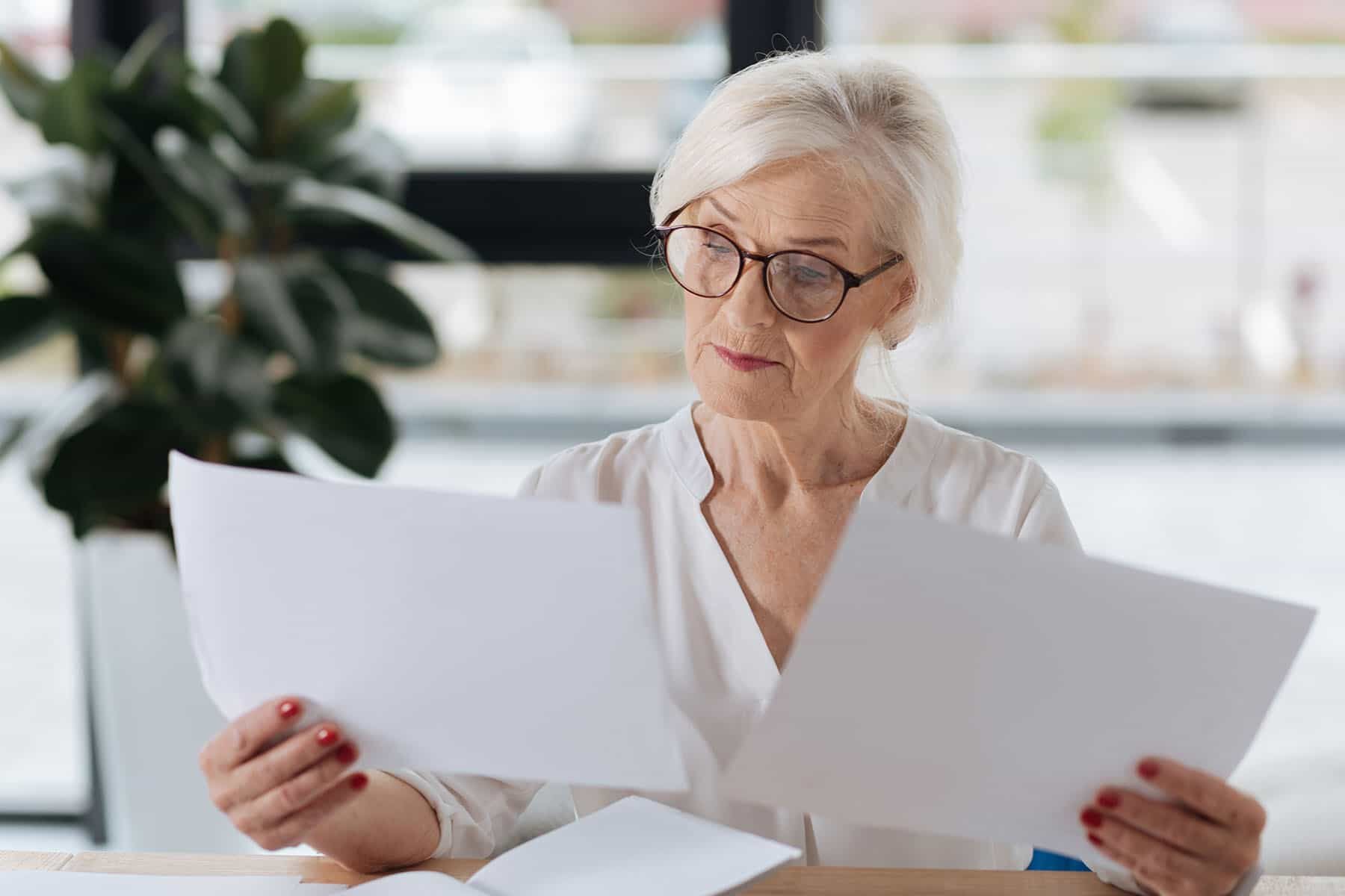 woman reading papers
