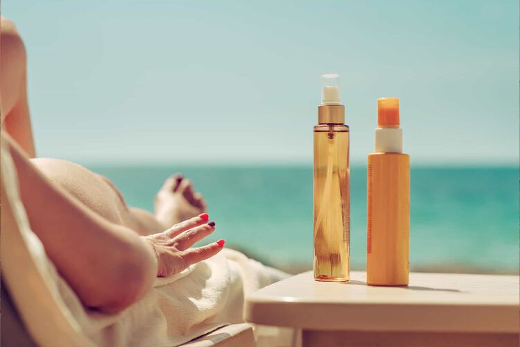 Woman with SPF sunscreen at the beach
