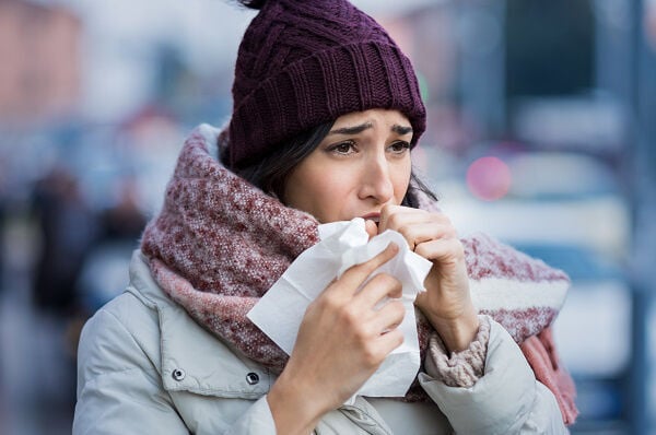 A woman coughing